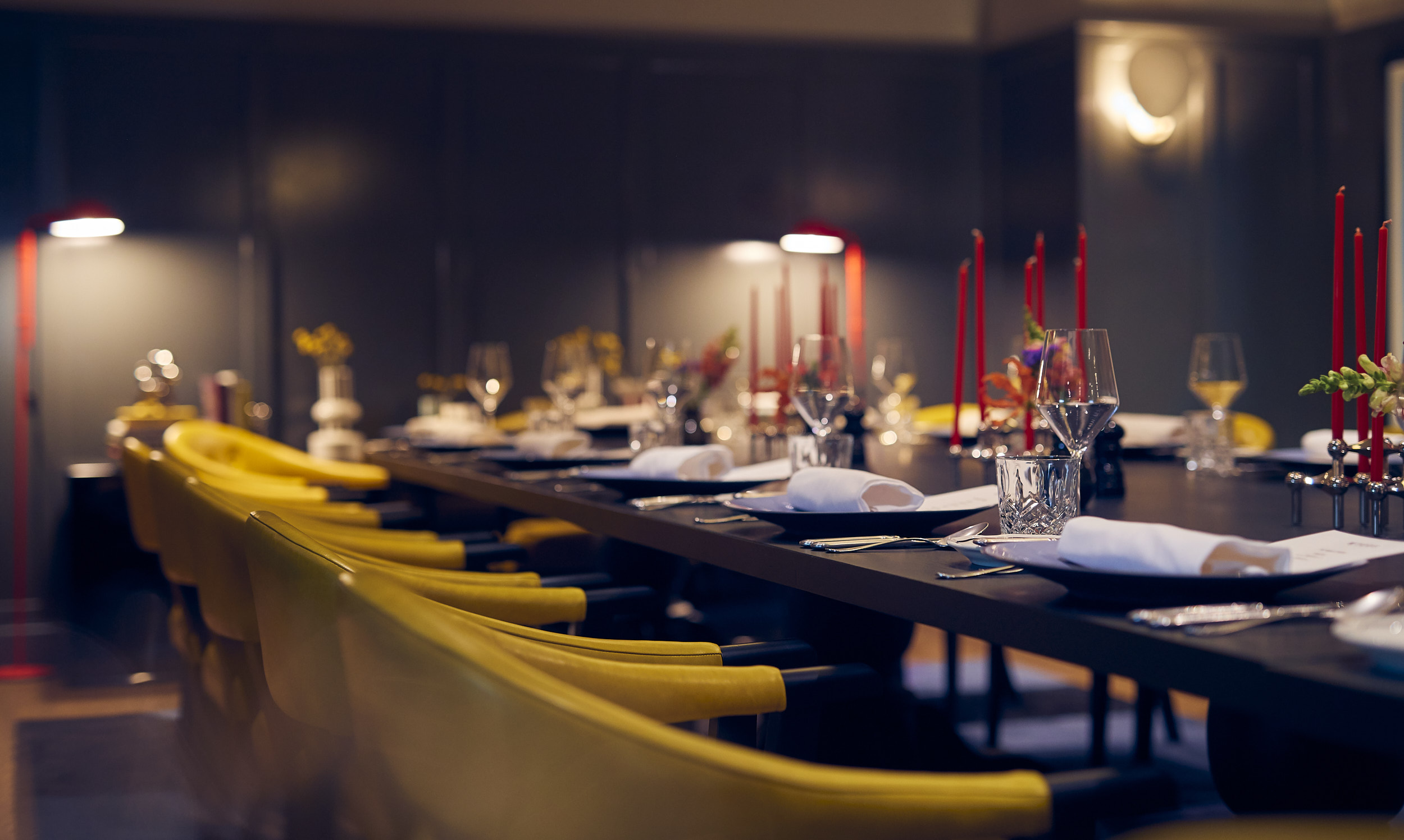 Room set with long tables and chairs for an event