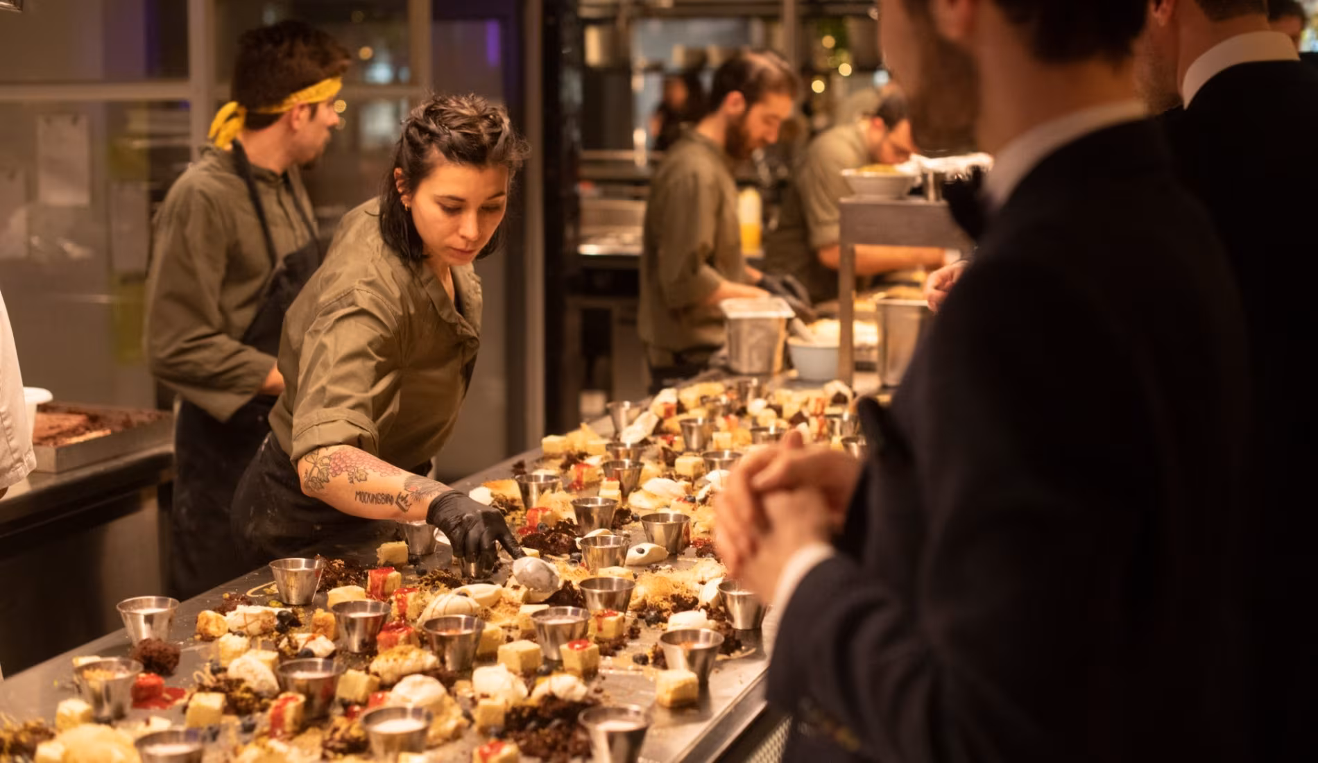 Guests serving themselves from a long buffet during an event