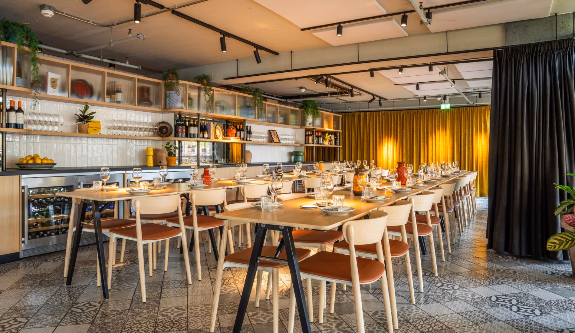 Room set with long tables and chairs for an event
