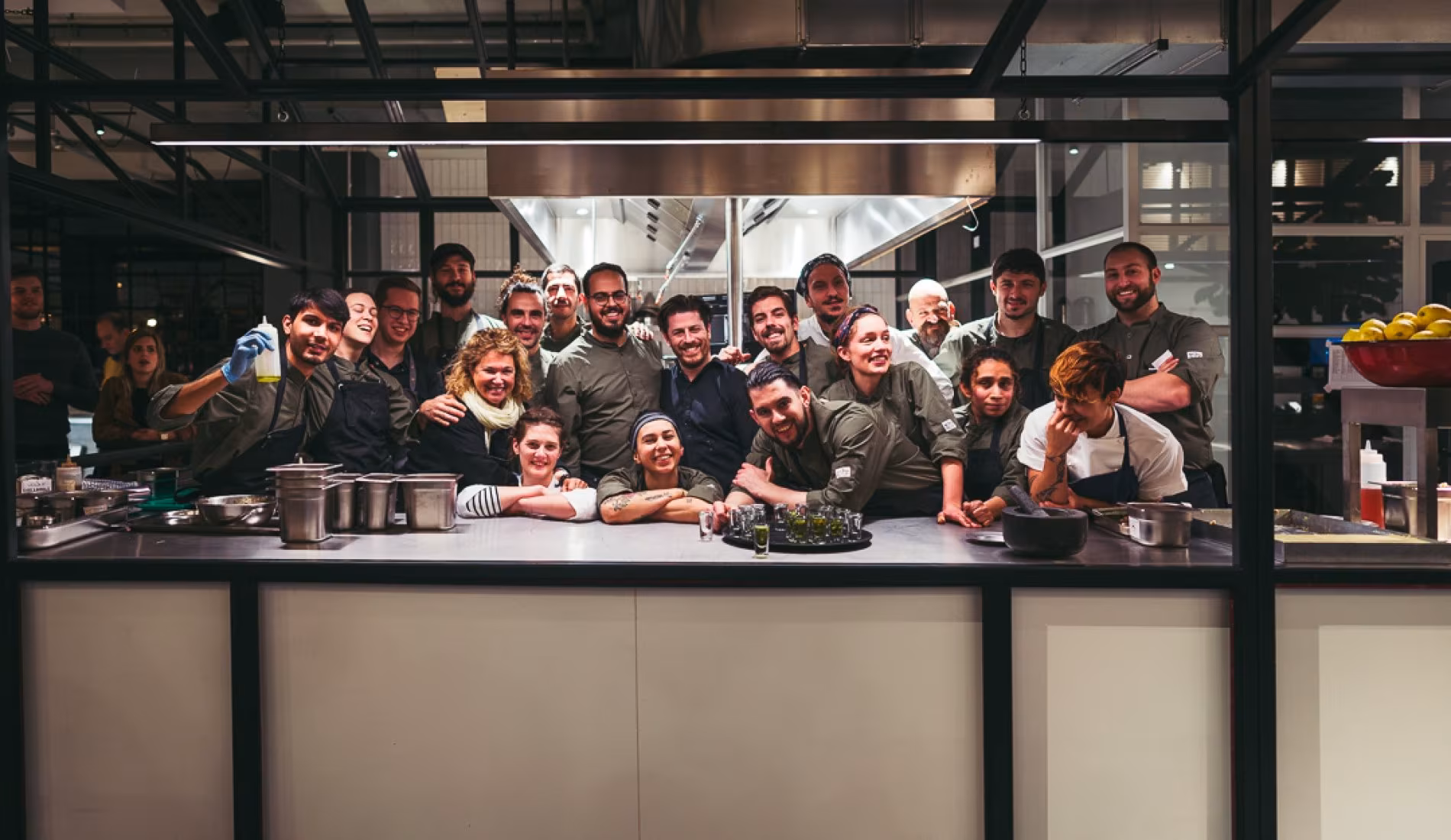 The NENI Amsterdam team gathered around the open kitchen