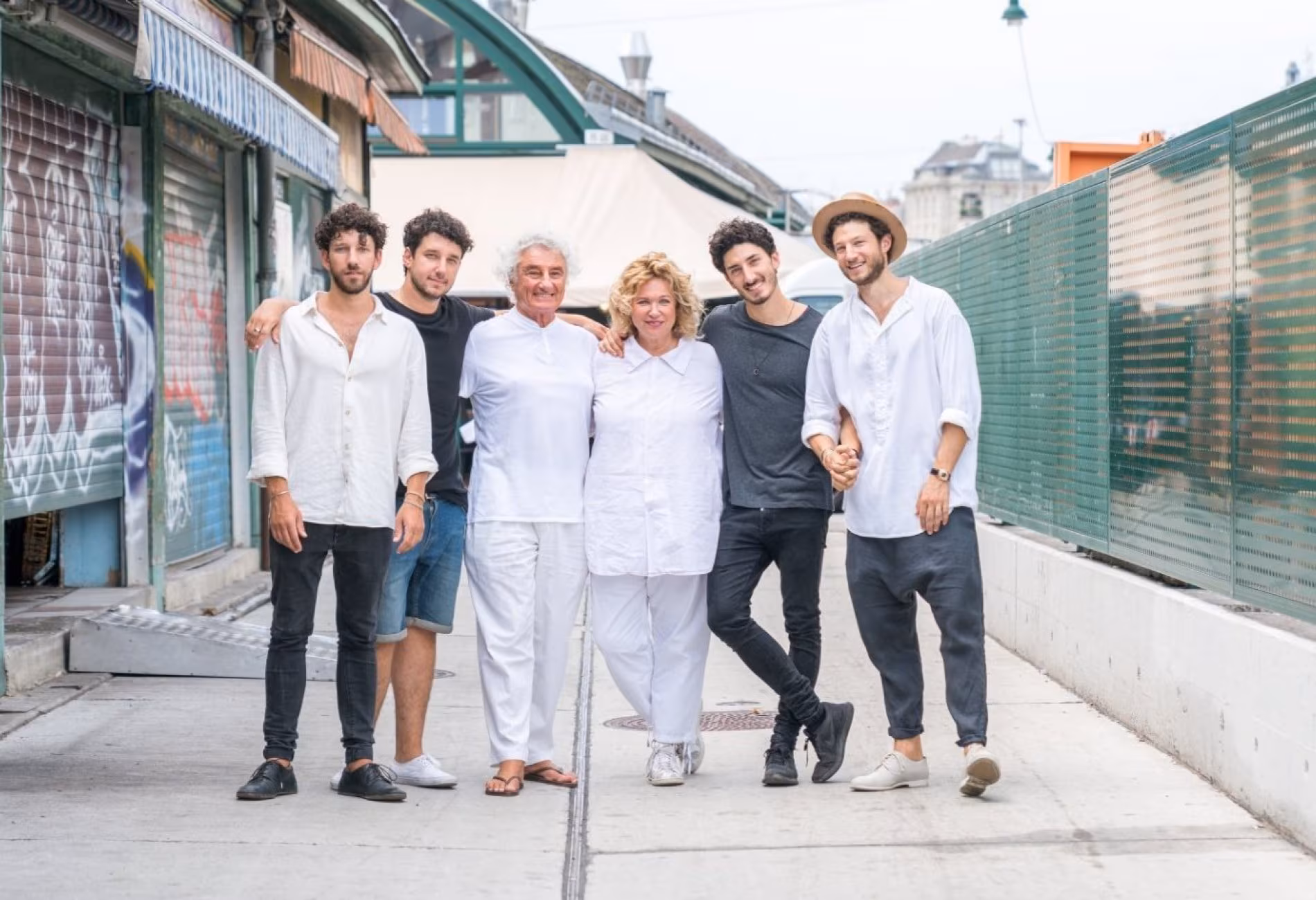 Haya Molcho and her four sons standing together in a street
